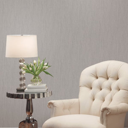 Grey textured wallpaper sample with a subtle plain texture in silver-grey.