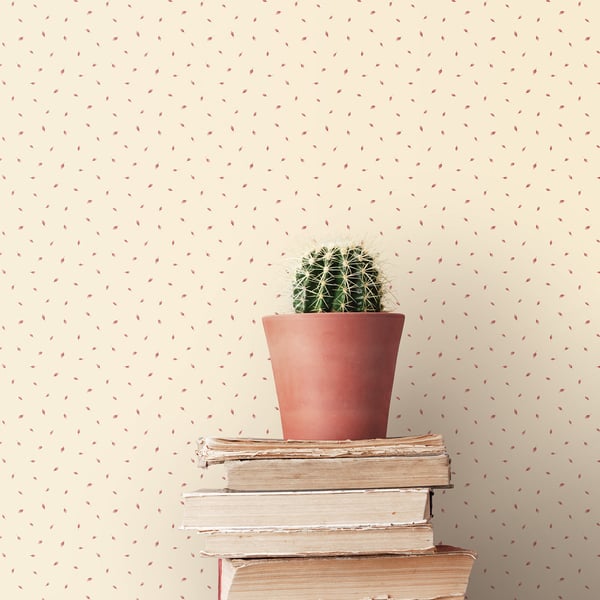 Cream wallpaper featuring a tiny leaf motif arranged in a polka-dot pattern.