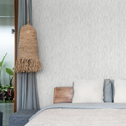 Silver-grey wallpaper with a subtle drizzle texture on a wall.
