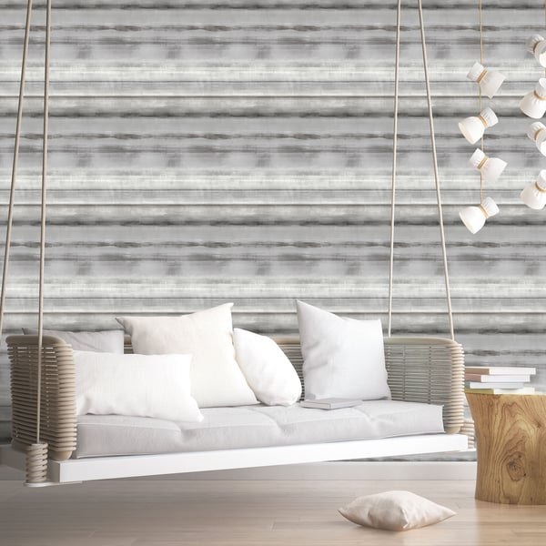 Cream woven wallcovering with a gray stripe pattern on the wall; rope hanging from the ceiling above a wooden stump table with books.