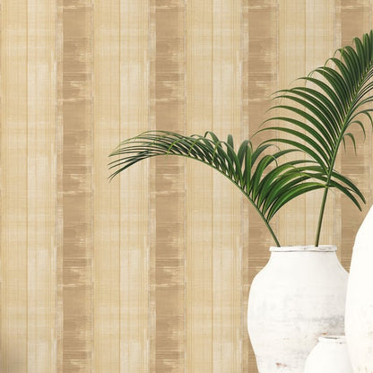 Beige striped wallpaper with a white ceramic vase and green palm fronds for tropical home decor.