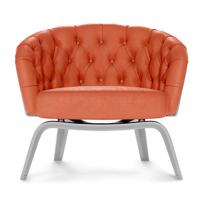 Orange tufted lounge chair with rounded back, cushioned seat, & sleek curved silver metal legs.