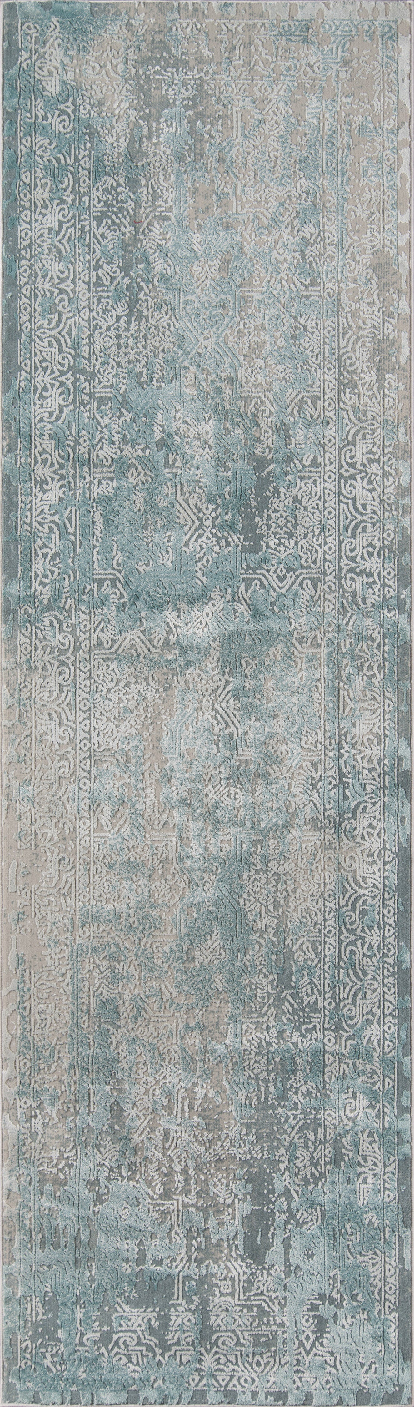 Blue-gray distressed vintage area rug with faded floral pattern; rectangular rug in muted teal, ivory and gray tones.