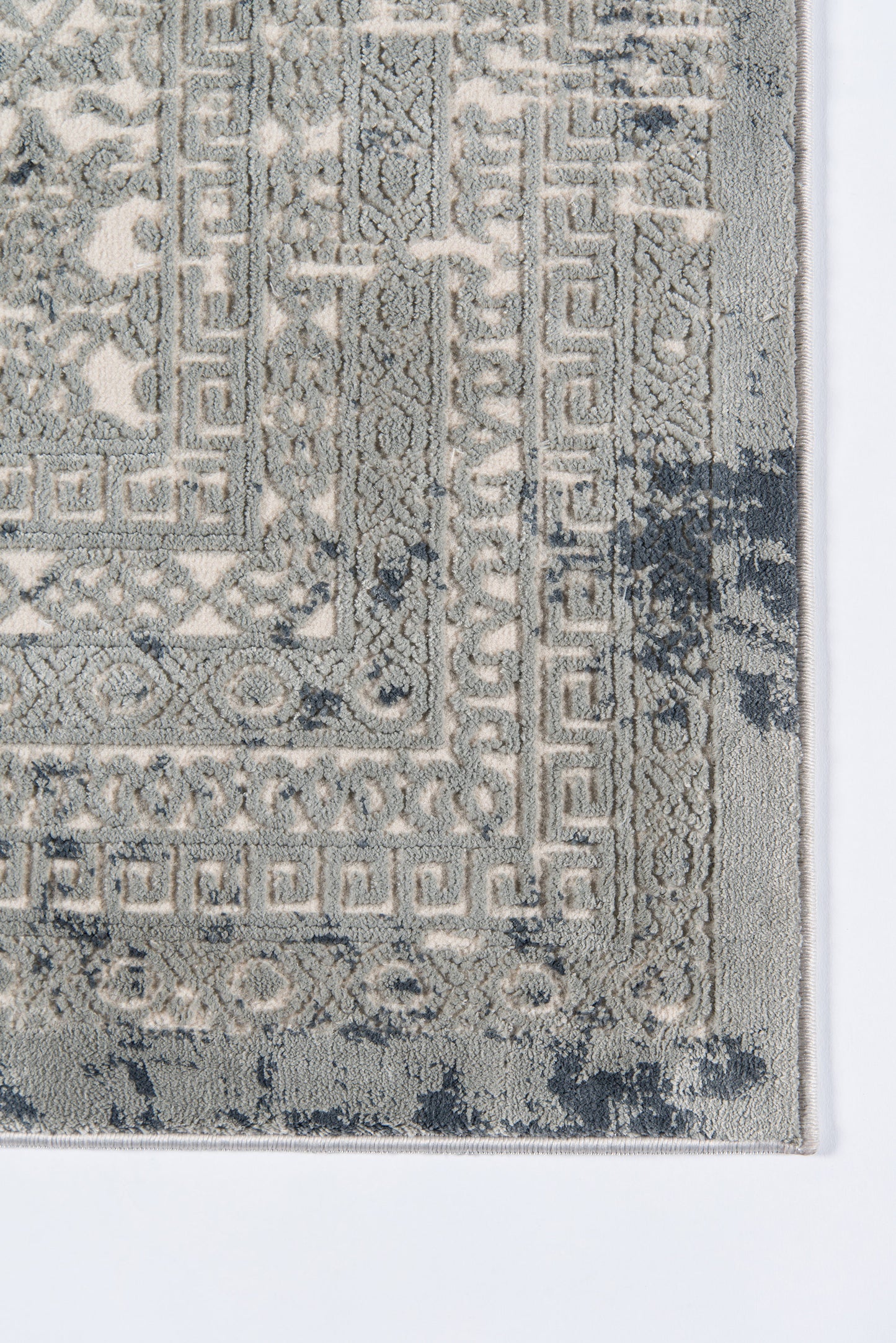 Grey and ivory distressed oriental rug with a Greek key border, rectangular, soft pile for living room decor.