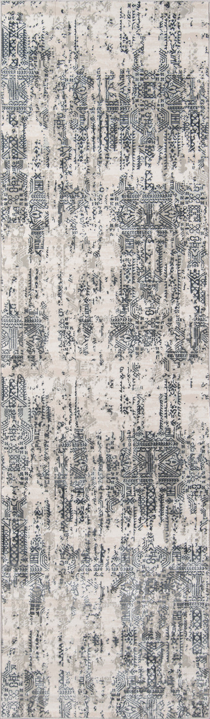 Gray and beige distressed abstract patterned area rug, rectangular, modern woven floor decor.