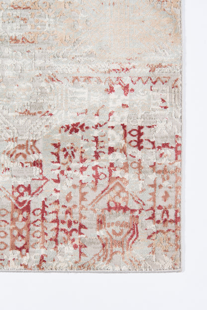 Rectangular vintage-style rug in cream and red with faded geometric/oriental motifs.