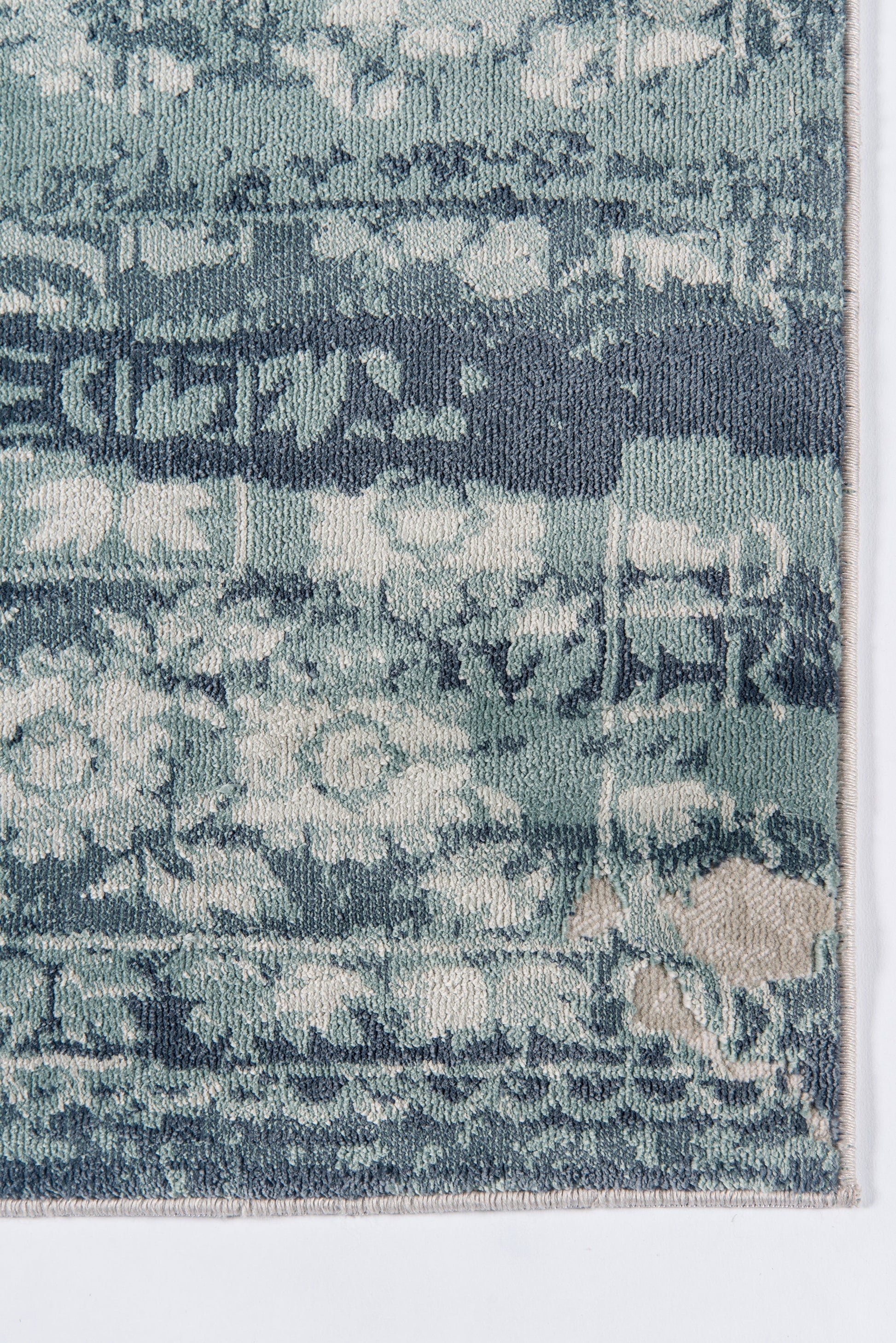 Distressed blue Oriental runner (2' x 8') with teal and navy hues, faded floral motifs and light beige fringe edge