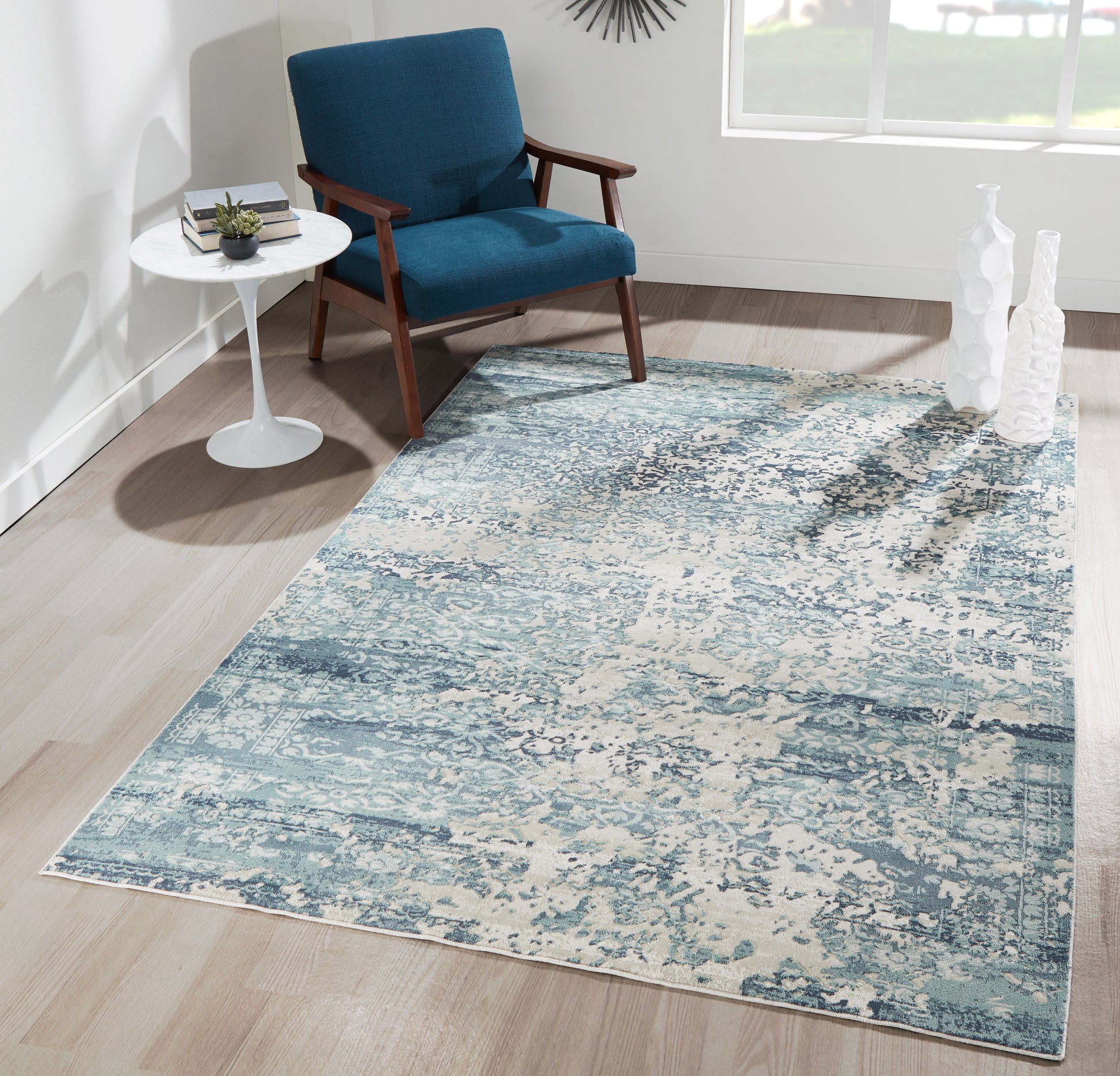 Blue 2' x 8' runner rug with an abstract pattern.