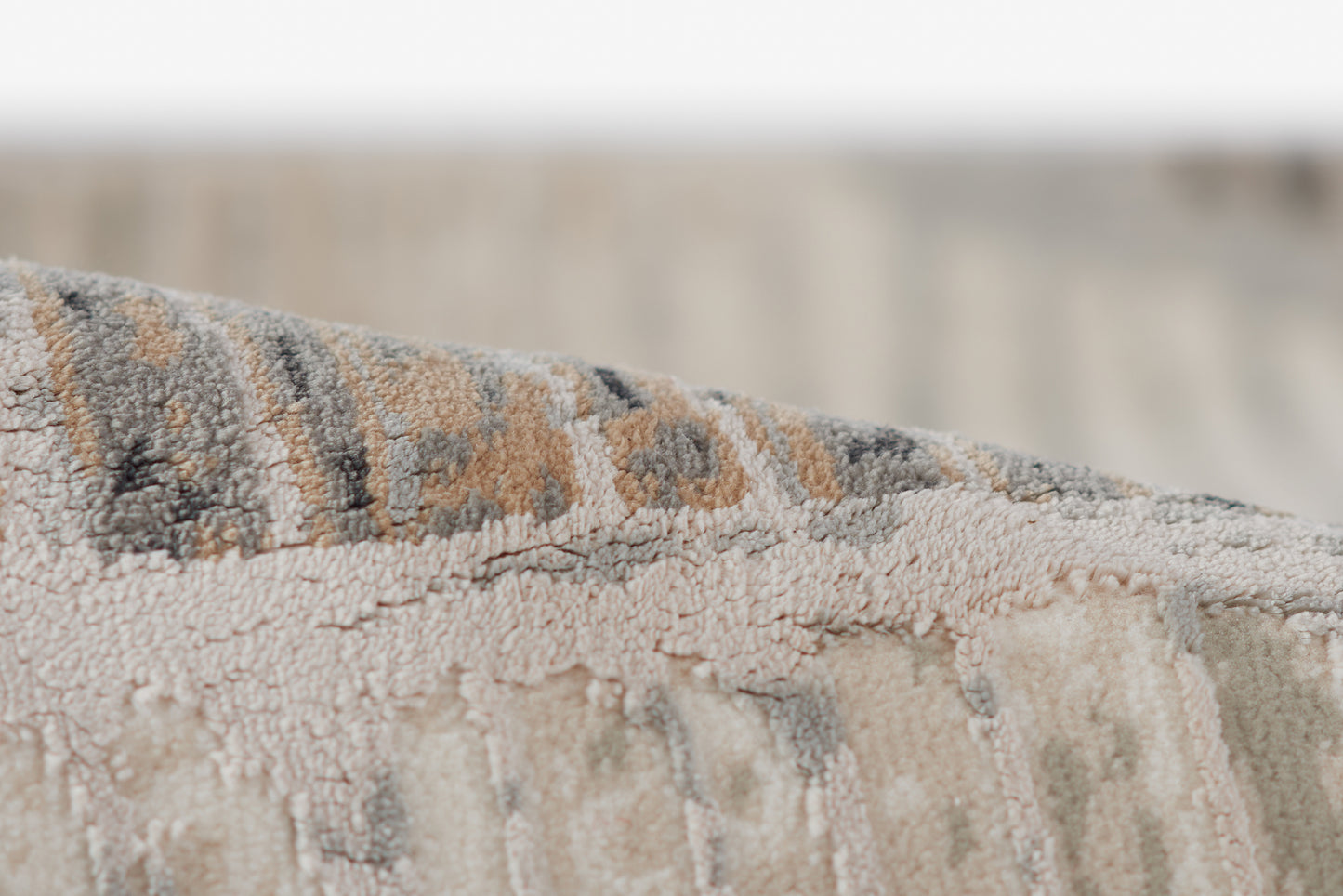 Genevieve gray rug with textured woven pile in gray, beige & brown tones, subtle geometric pattern, 2' x 3'.