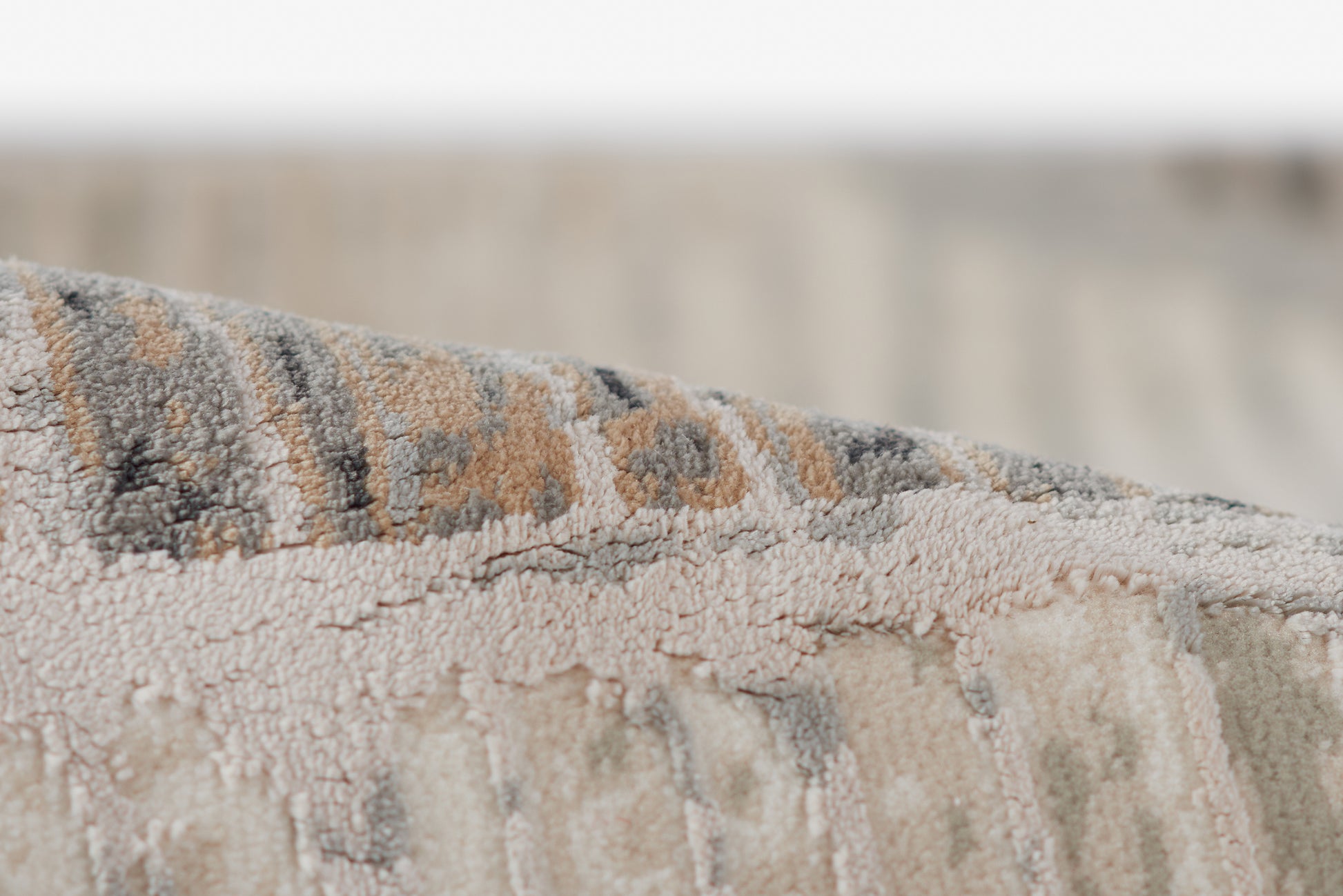 Genevieve gray rug with textured woven pile in gray, beige & brown tones, subtle geometric pattern, 2' x 3'.