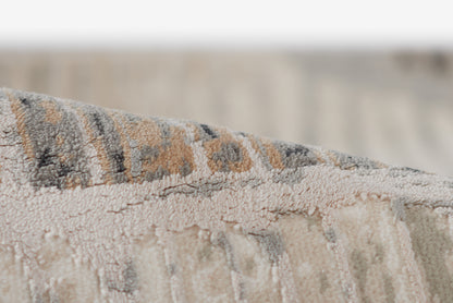 Genevieve gray rug with textured woven pile in gray, beige & brown tones, subtle geometric pattern, 2' x 3'.