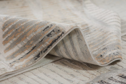 Neutral gray-beige striped woven rug with a distressed pattern and soft texture.