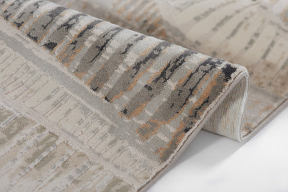 Abstract gray-beige area rug with ivory, charcoal brush-stroke pattern; plush pile and rolled edge.