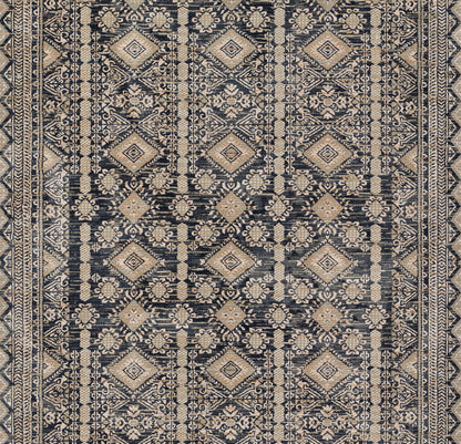 Navy and beige oriental rug with repeating geometric diamond medallions and floral motifs; dense woven pattern.