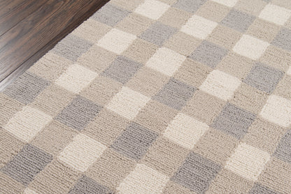Neutral geometric runner with beige, cream and gray checker squares on dark wood floor.