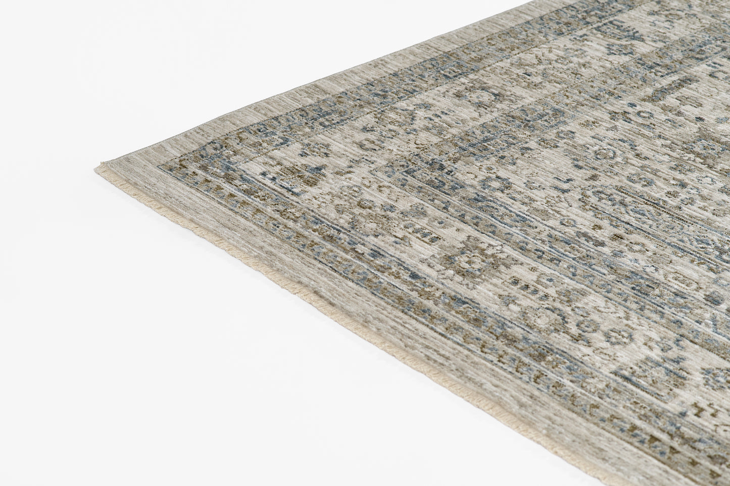 Blue-gray vintage rug with intricate beige and ivory floral pattern, bordered edges, rectangular woven design.