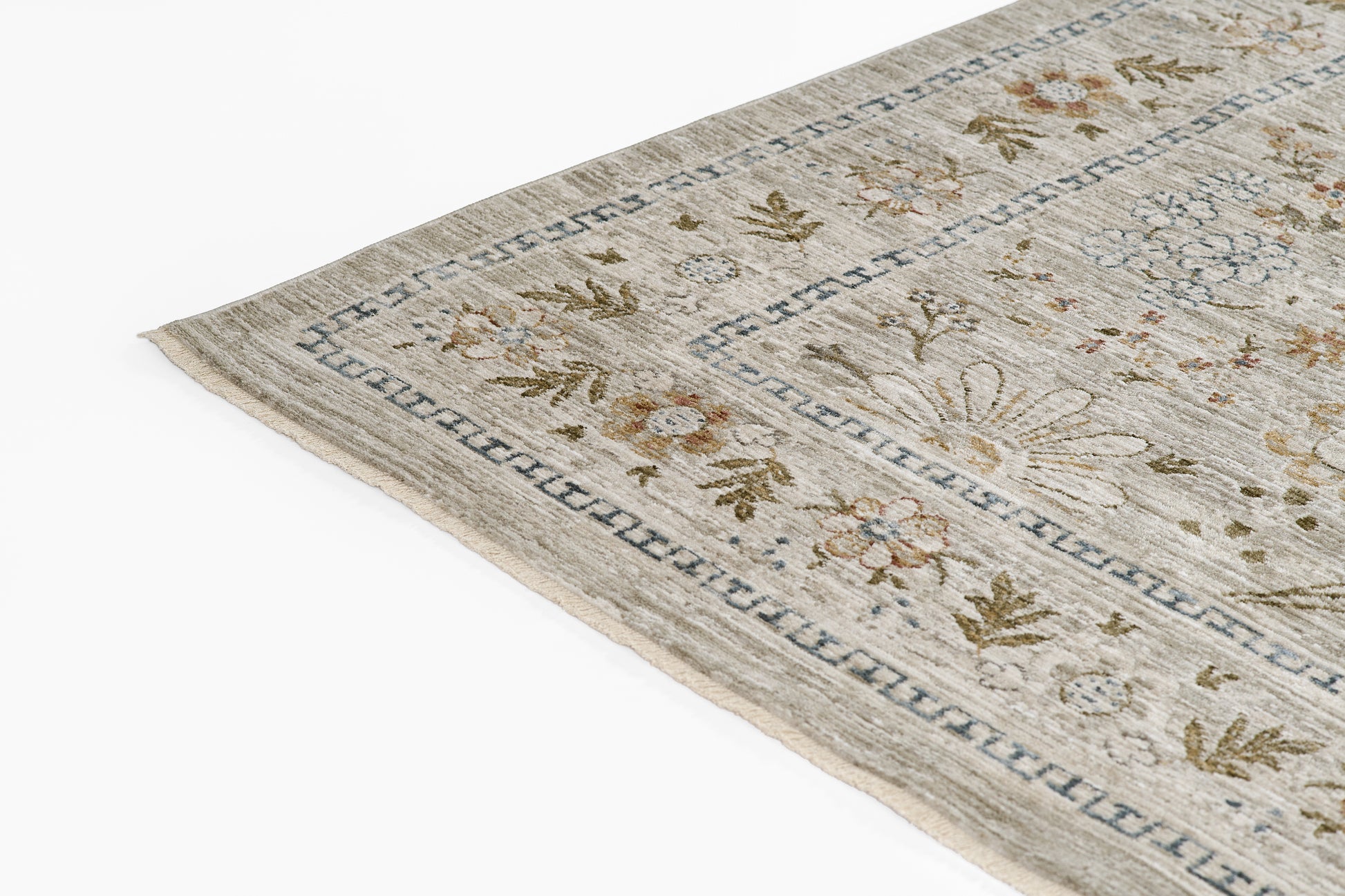 Rectangular beige oriental-style rug with a blue geometric border and subtle brown and gray floral motifs.