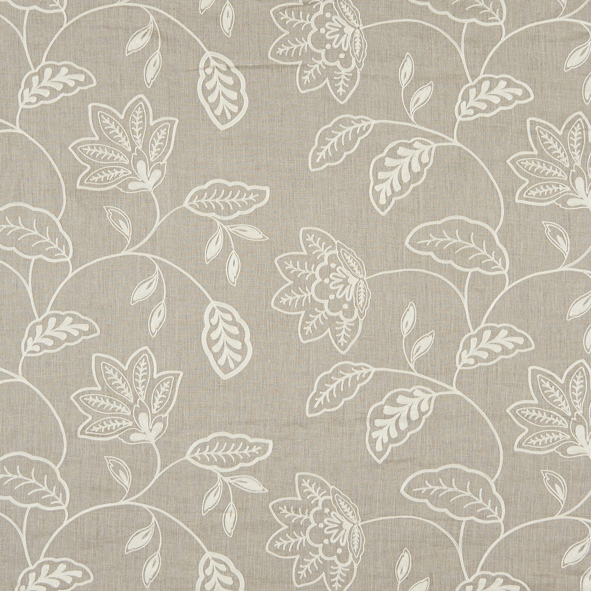 Beige linen-textured fabric with white botanical vines & blossoms embroidery; timeless textile.
