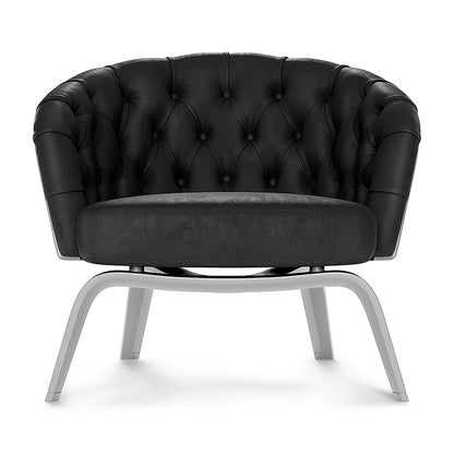 Black tufted textured fabric lounge chair with curved silver metal legs and diamond button stitching.