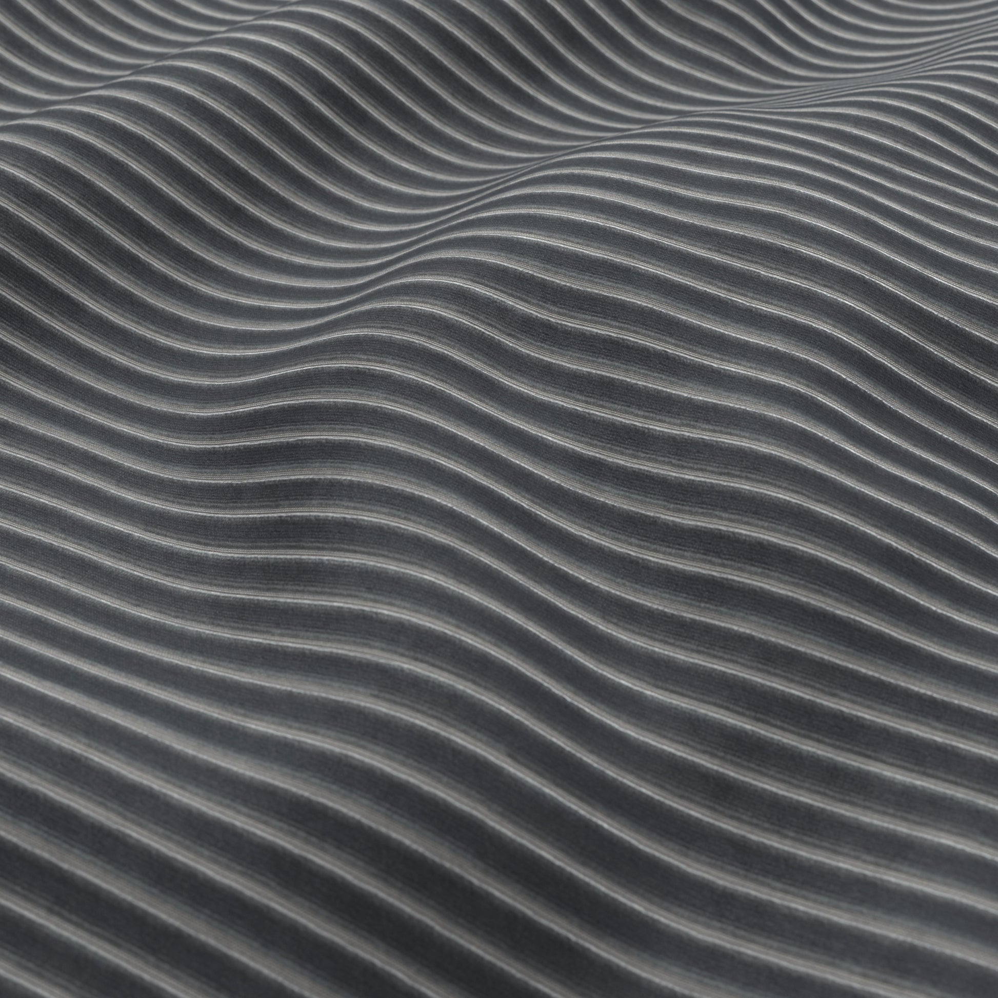 Close-up of charcoal blue corduroy fabric texture with ribbed ridges and a subtle sheen.