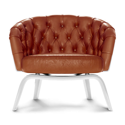 Brown tufted leather lounge chair with rounded back, cushion seat, and white curved-metal legs.