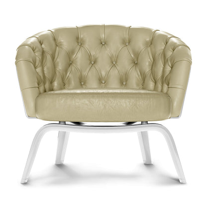 Beige tufted leather lounge chair with buttoned back, rounded arms, and white curved metal legs.
