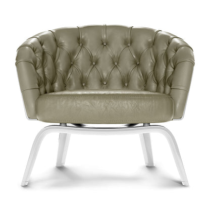Olive green tufted leather lounge chair with diamond button tufting and white curved metal legs.
