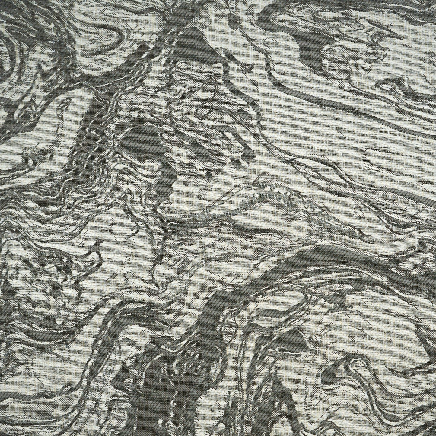 Charcoal gray and beige marbled pattern fabric; abstract textile ideal for upholstery or drapery.