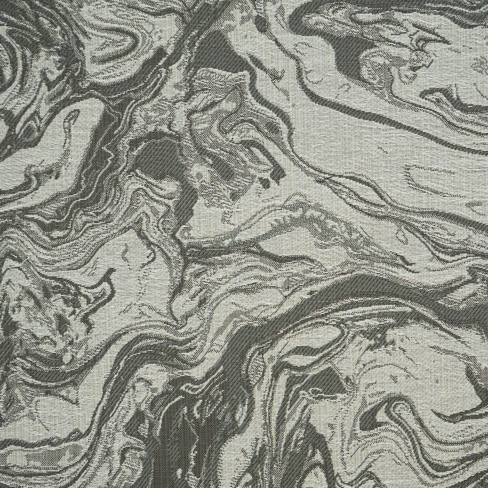 Charcoal gray and beige marbled pattern fabric; abstract textile ideal for upholstery or drapery.