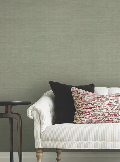 Cream textured wallpaper with a desert sage grasscloth pattern on the wall.