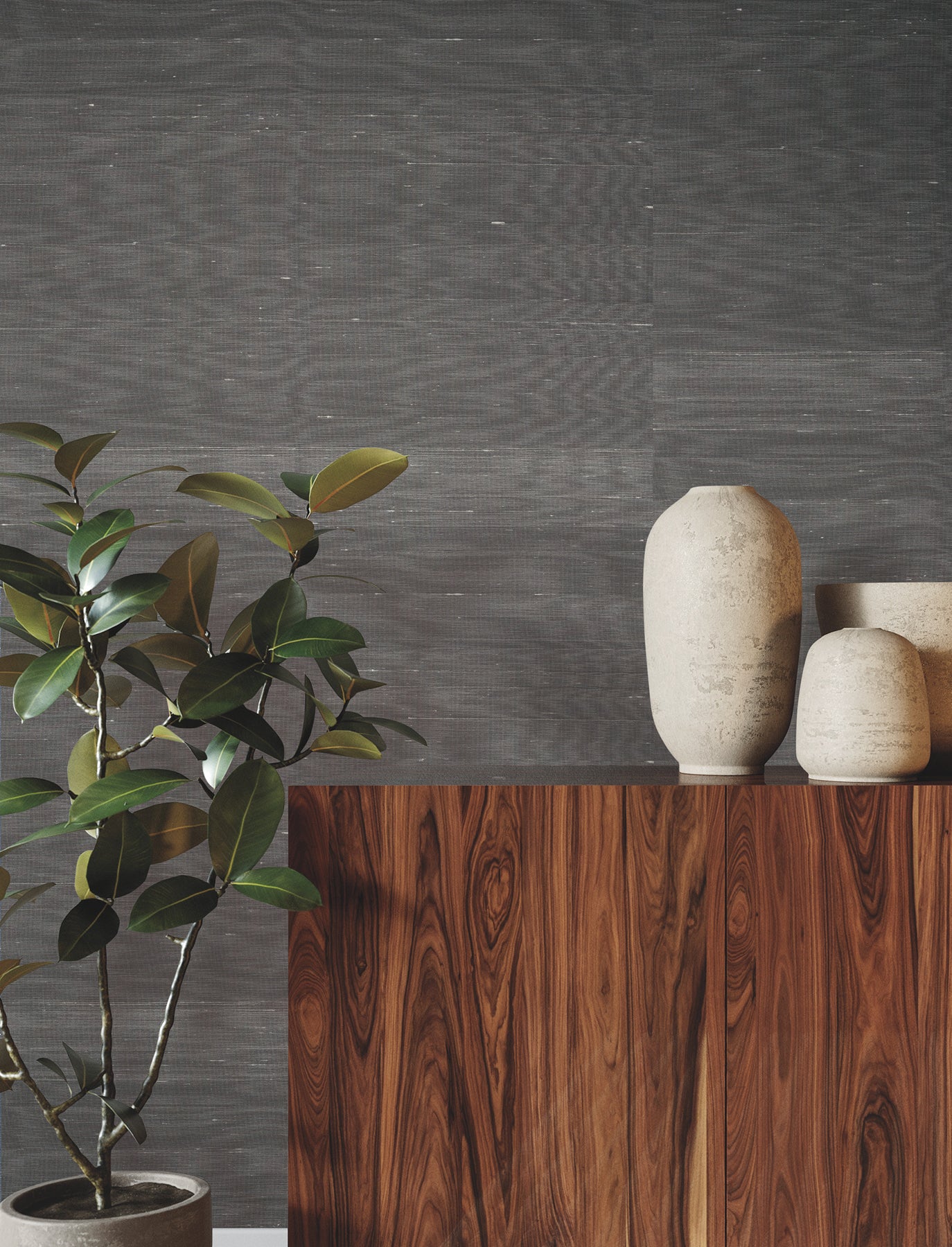 Graphite wallpaper on a wall with a subtle woven texture.