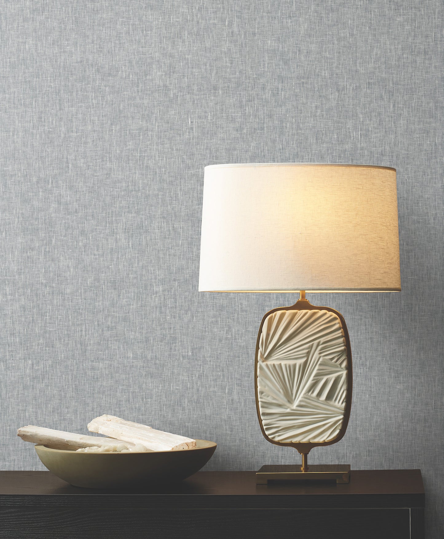 Room scene with blue wallcovering featuring sheer linen texture and natural weave pattern on the walls.