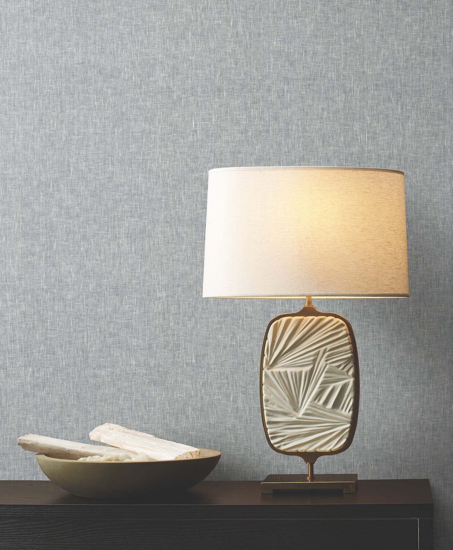 Room scene with blue wallcovering featuring sheer linen texture and natural weave pattern on the walls.