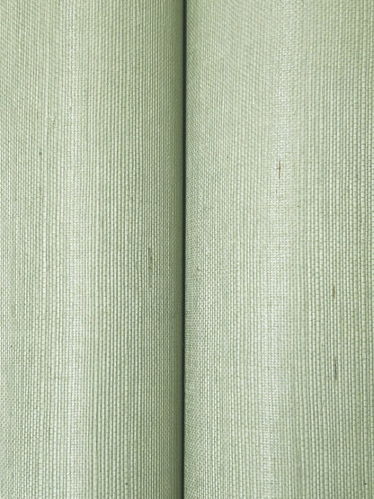 Close-up of soft sage grasscloth wallpaper with vertical ribbed texture.