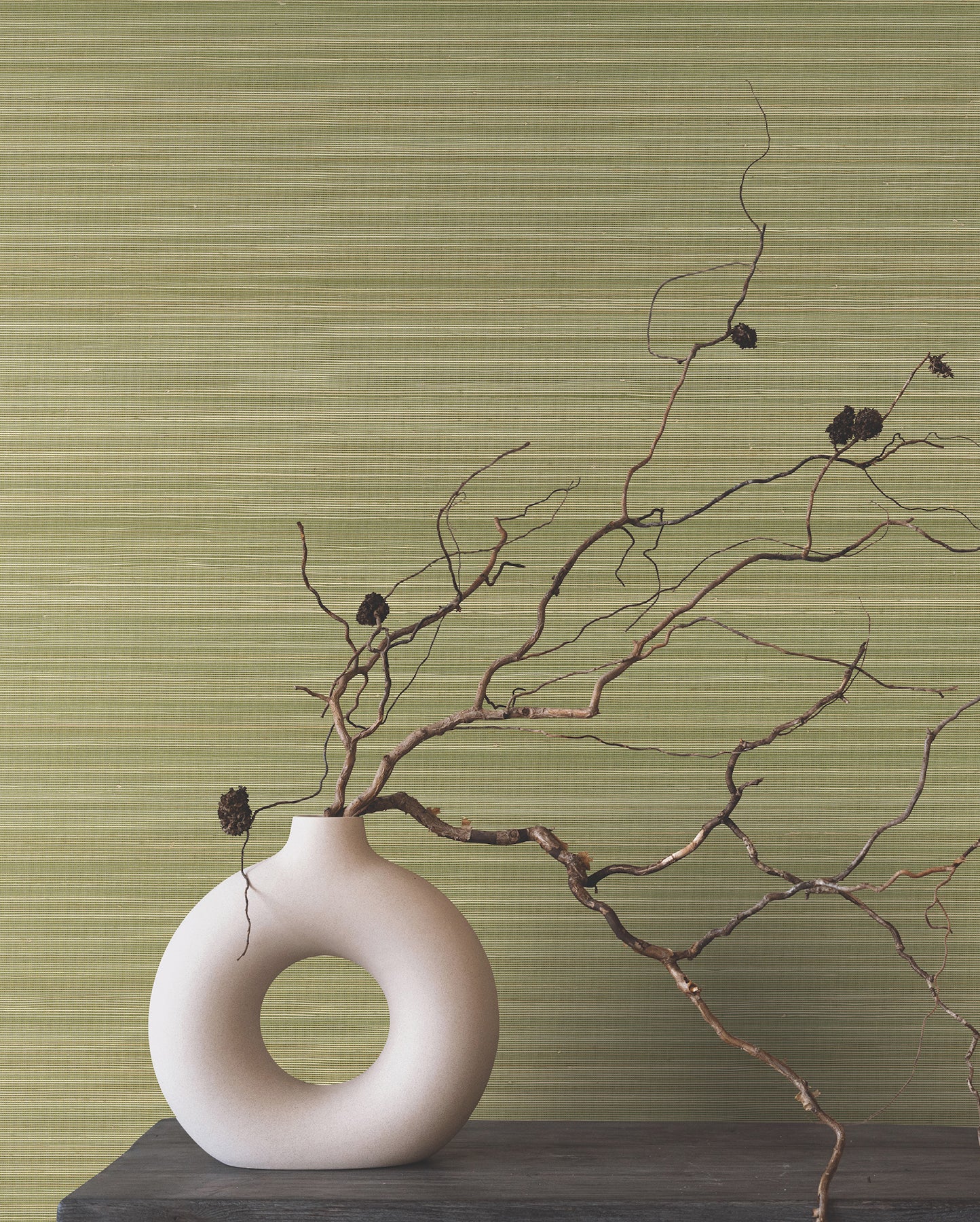 Moss green abaca grasscloth wallpaper with a smooth finish.