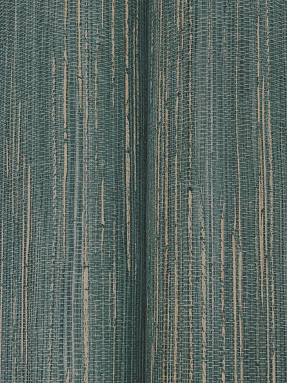 Close-up of multicolored hemp grasscloth wallpaper in teal and blue tones, showing a woven texture.