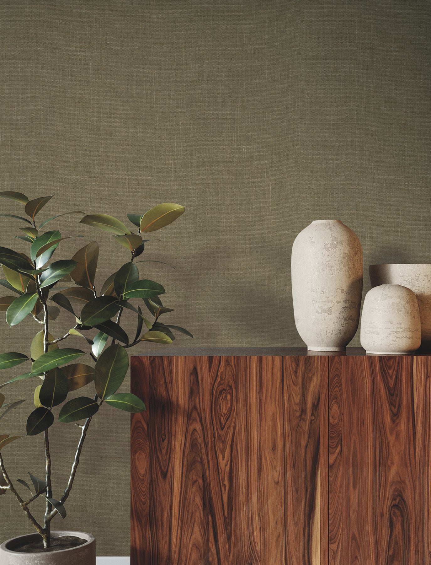 Dark wood sideboard with natural grain, potted plant on left & three beige ceramic vases on top right against olive wall.