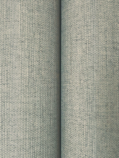 Close-up of light blue-gray sisal wallpaper with a fine woven grid texture; two rolls side by side.