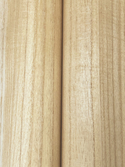 Two light blonde wood planks with visible grain and a central seam; smooth natural finish.