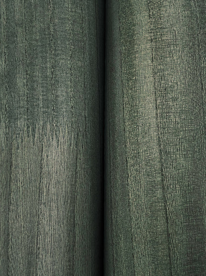Close-up of two olive-green textured upholstery fabric bolts with visible grain and seam.
