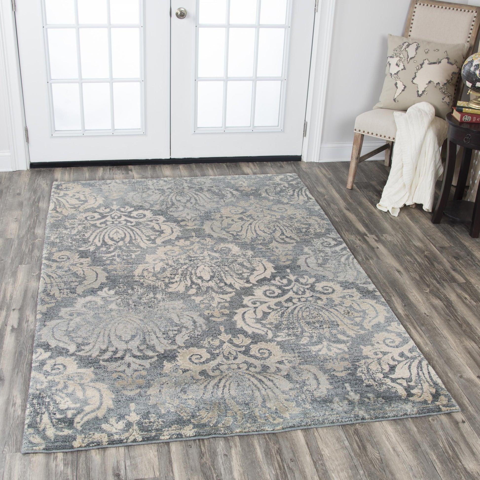 10' x 13' rug in a transitional style with a neutral, subtle pattern.