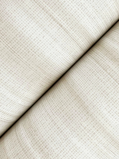 White brushed linen wallpaper with a subtle dotted grid pattern, folded along a diagonal seam.