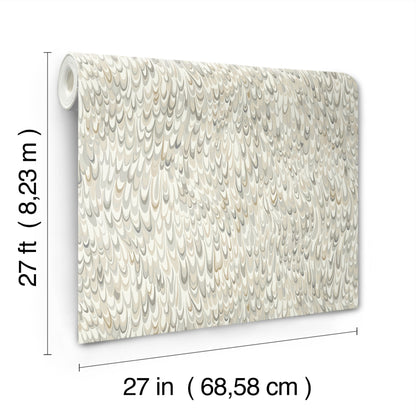 Cream-beige wallpaper roll with subtle scalloped teardrop/scale pattern, rolled edge; 27 ft long by 27 in wide.