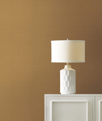 Grasscloth wallpaper in Dijon yellow with a natural sisal-weave texture.
