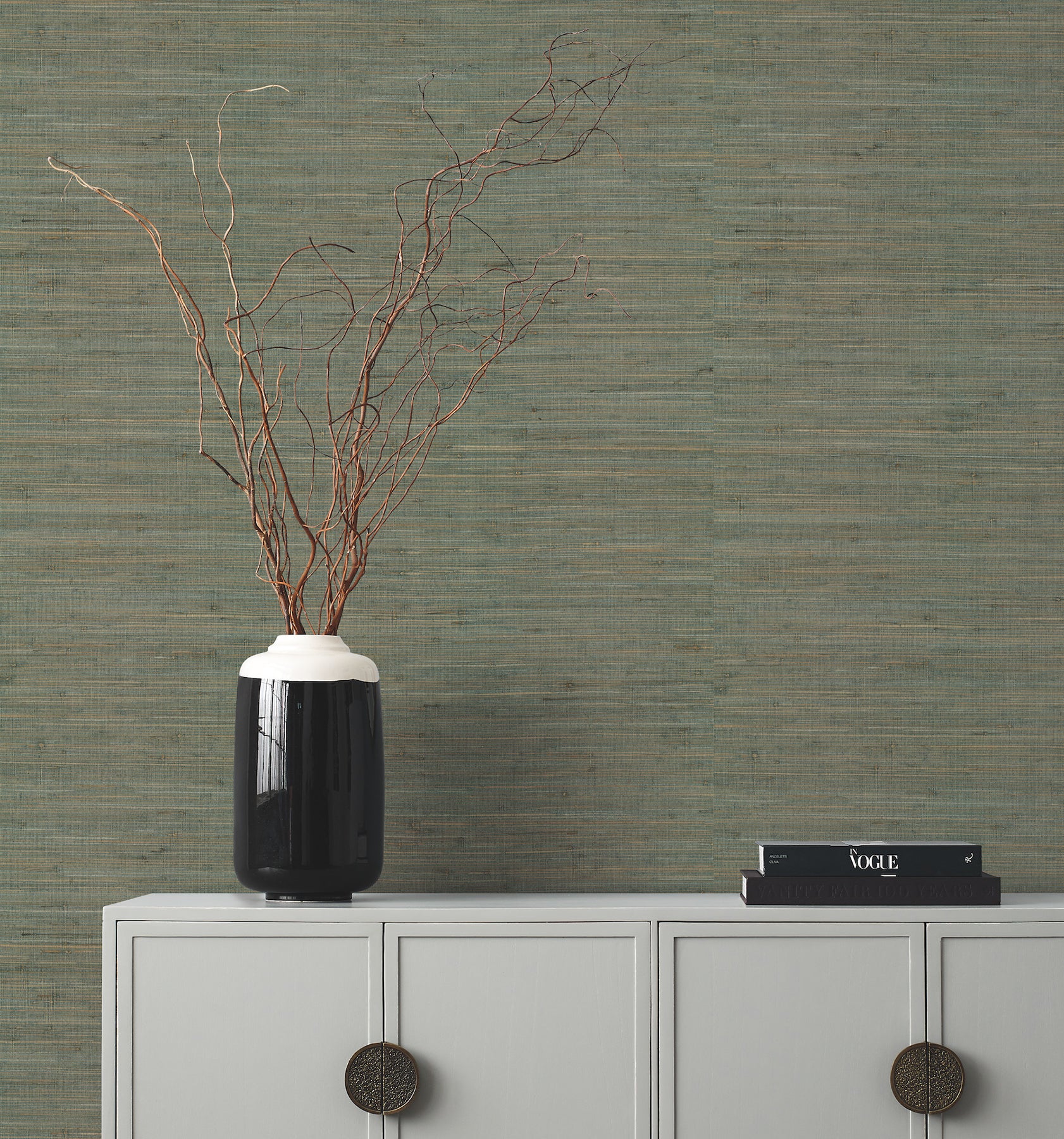 Green grasscloth wallpaper with a subtle woven texture.