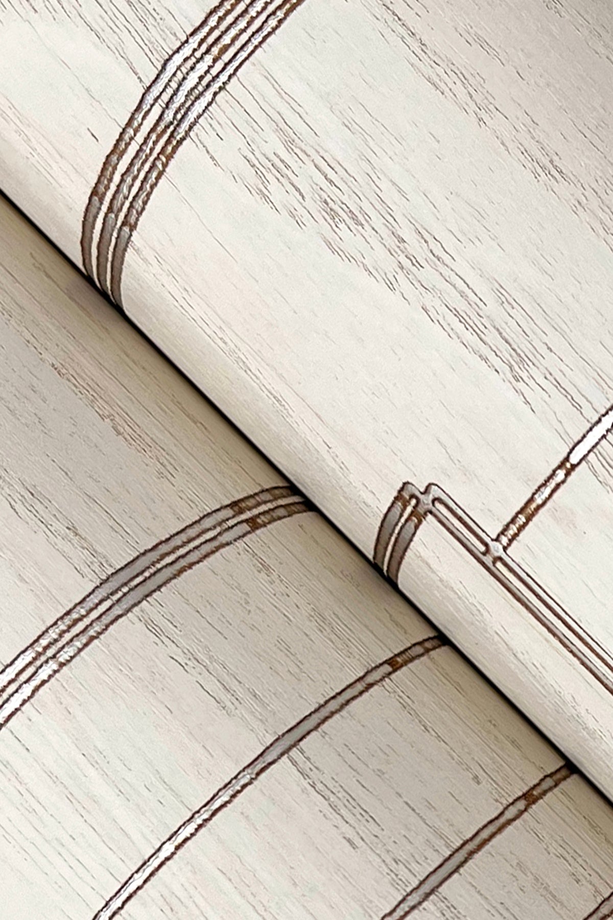 White wallpaper with subtle wood-veneer texture and light inlay lines, rolled sheet