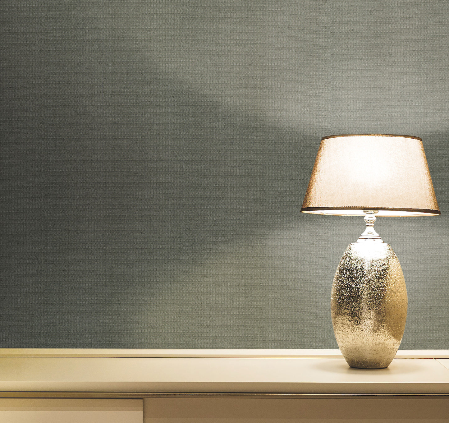 Green grasscloth wallpaper with a natural wicker texture.