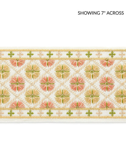 Embroidered tape fabric featuring pink and green floral medallions on cream with gold thread edging.