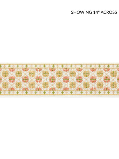 Embroidered tape fabric with peach floral medallions on cream, framed by green lattice borders and gold edging.