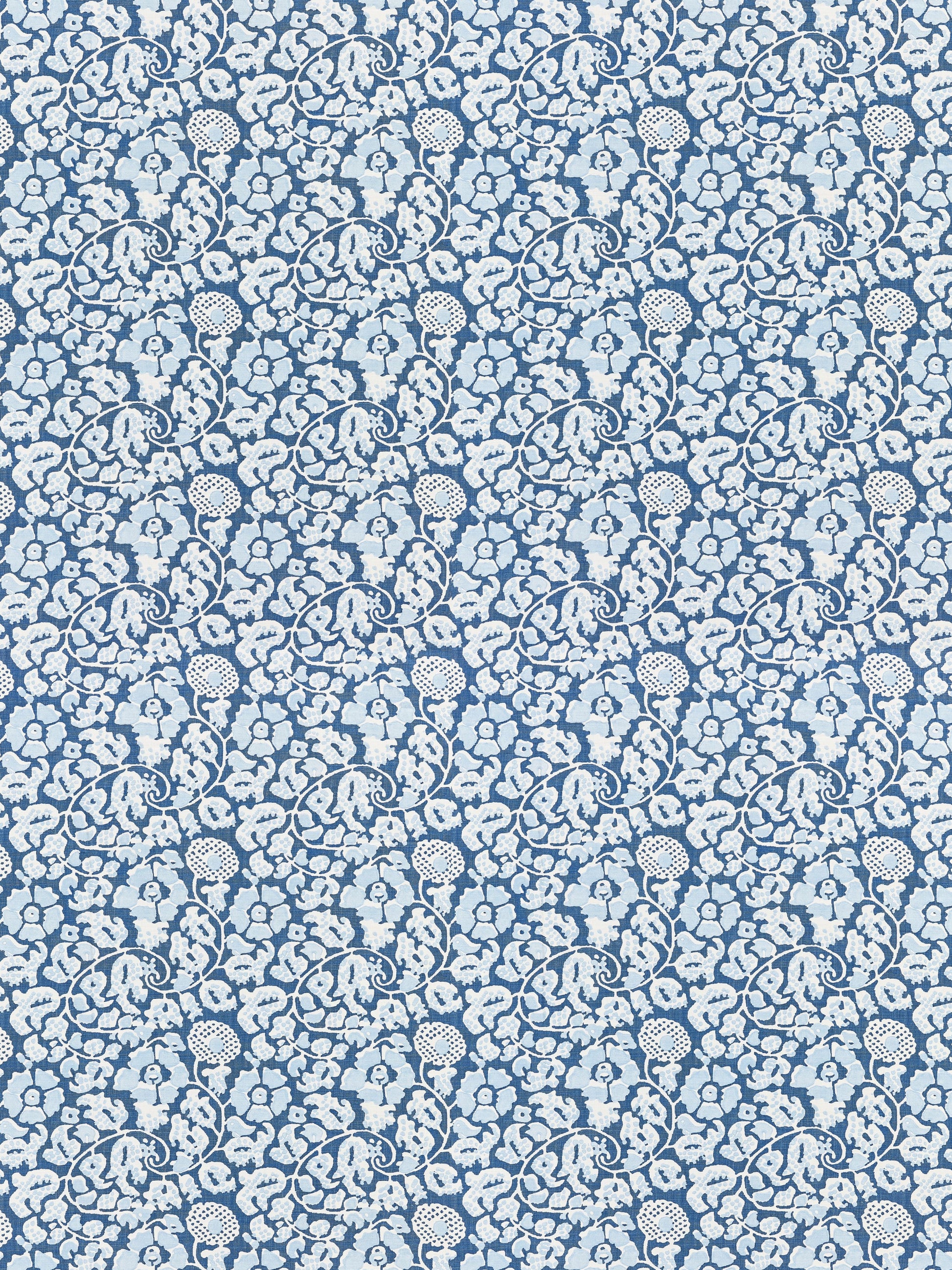 Blue fabric with white damask floral scroll pattern; ornate, repeating motif suitable for upholstery or apparel.